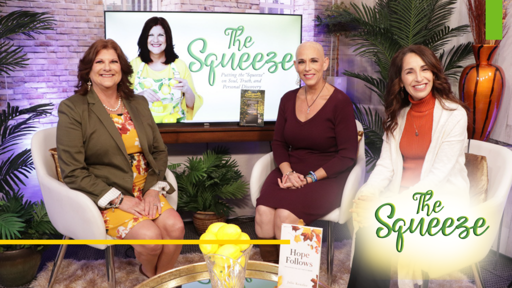Michelle FAust conducting an interview with her guest on her The Squeeze TV Show